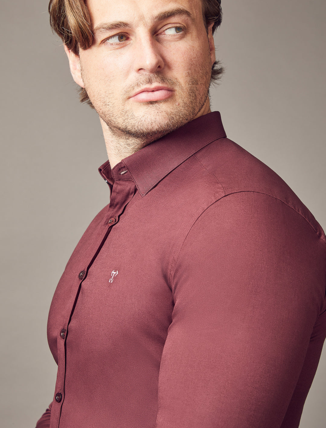 A burgundy shirt with a tapered fit from Tapered Menswear, designed to highlight the muscle-fit features for a flattering and distinctly defined appearance.