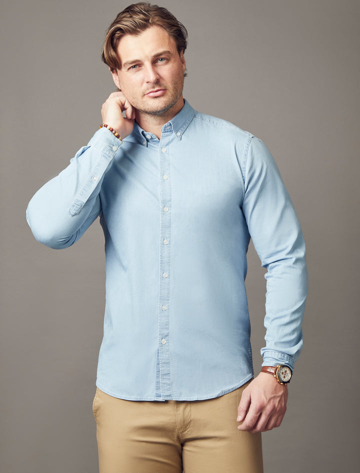 light wash denim tapered fit shirt, emphasizing the muscle fit features for a flattering and well-sculpted look by Tapered Menswear