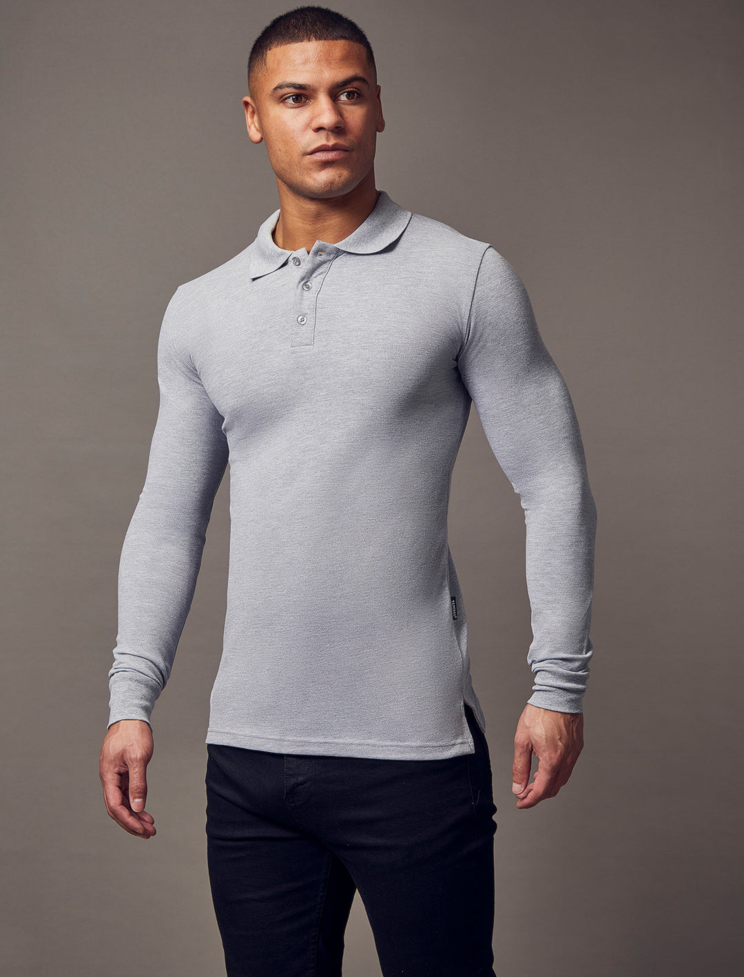 Grey muscle-fit polo shirt from Tapered Menswear, featuring a tapered fit and high-quality fabric, designed for the contemporary man.
