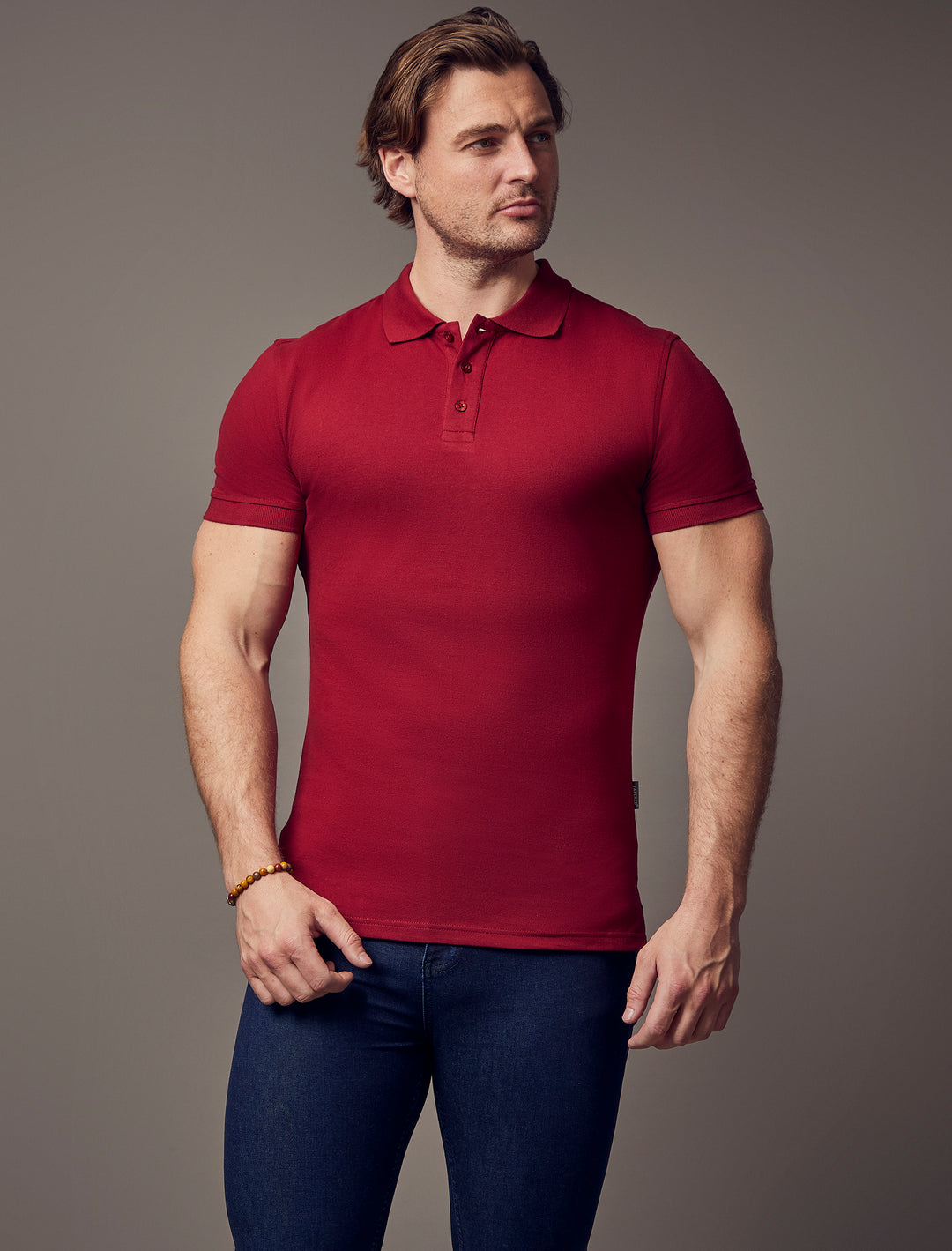 Burgundy short-sleeve polo shirt with a muscle fit from Tapered Menswear, showcasing the tapered design and superior quality.