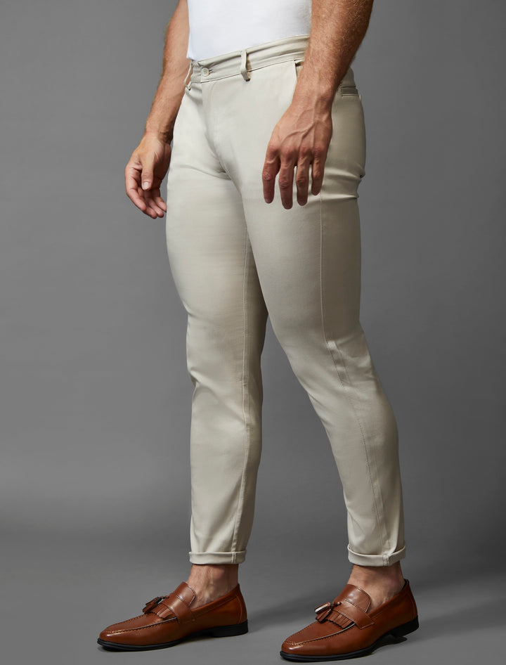 Tapered Menswear showcases its beige chinos, designed in an athletic fit and enhanced with stretch.