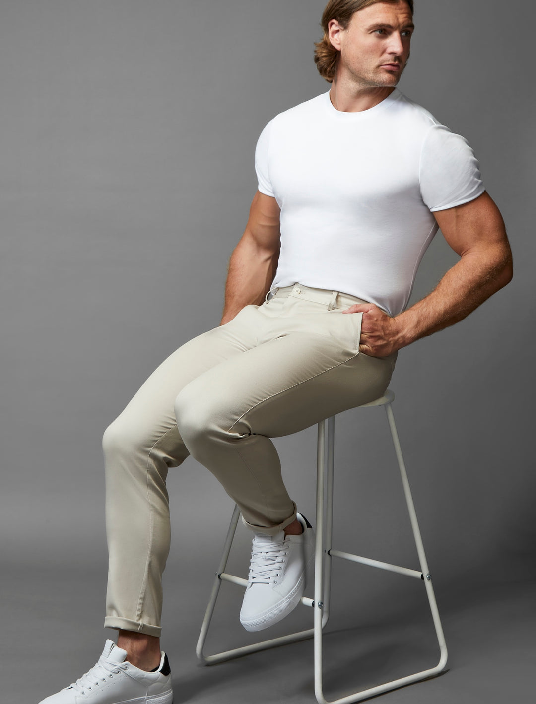 Athletic fit beige chinos with stretch, a hallmark of Tapered Menswear's attention to detail.