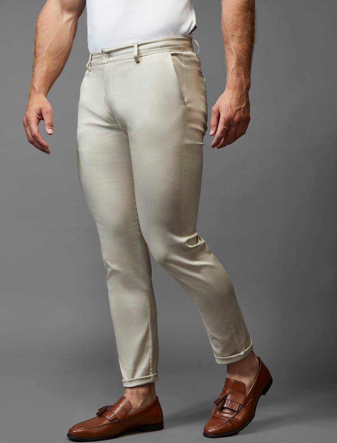 Beige chinos by Tapered Menswear, epitomizing the athletic fit trend with added stretch for movement.