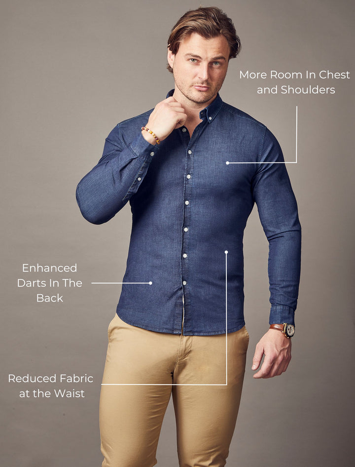 Proportionally tailored navy blue denim shirt in a tapered and muscle fit style, best suited for a muscular build.