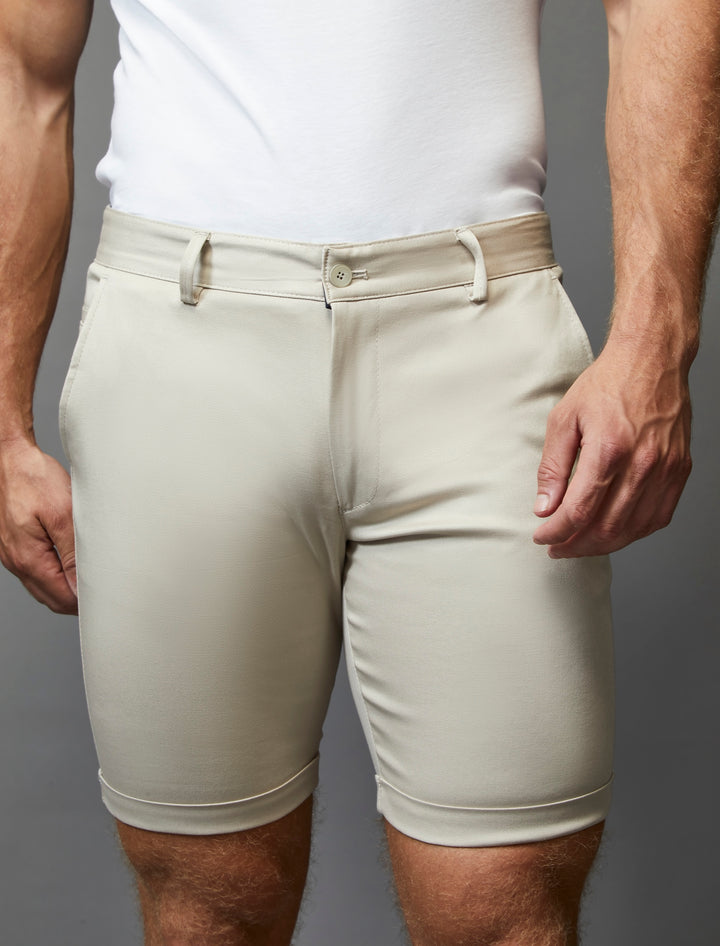 Beige stretch chino shorts designed for an athletic fit by Tapered Menswear.