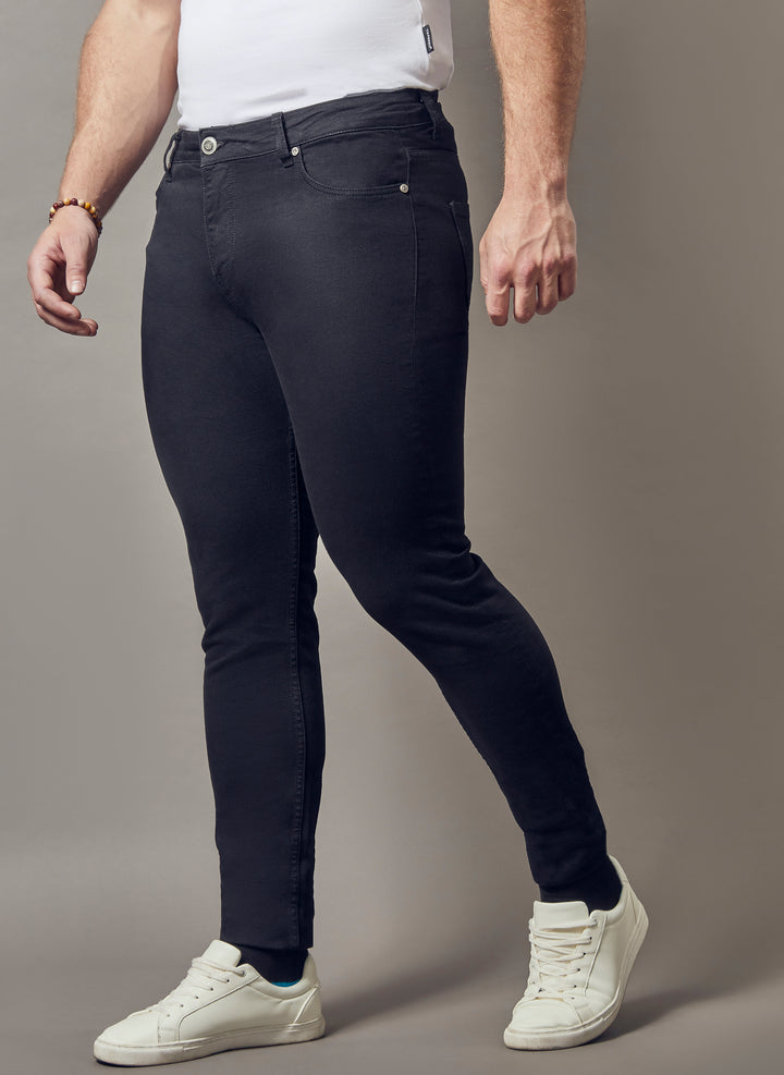 black muscle fit jeans, showcasing the tapered fit and superior quality offered by Tapered Menswear