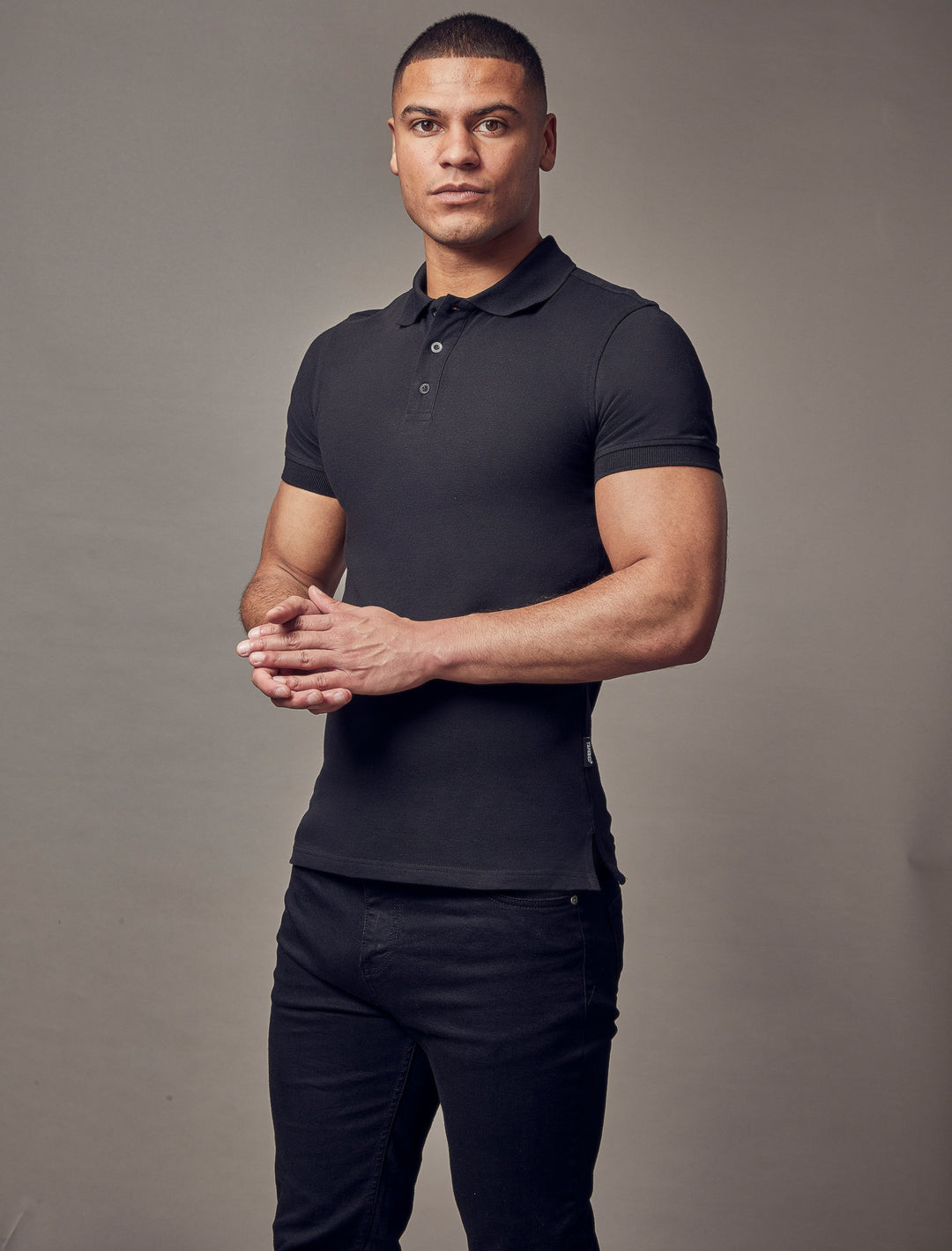 short sleeve black tapered fit polo shirt by Tapered Menswear, showcasing the muscle fit design for a comfortable and modern silhouette
