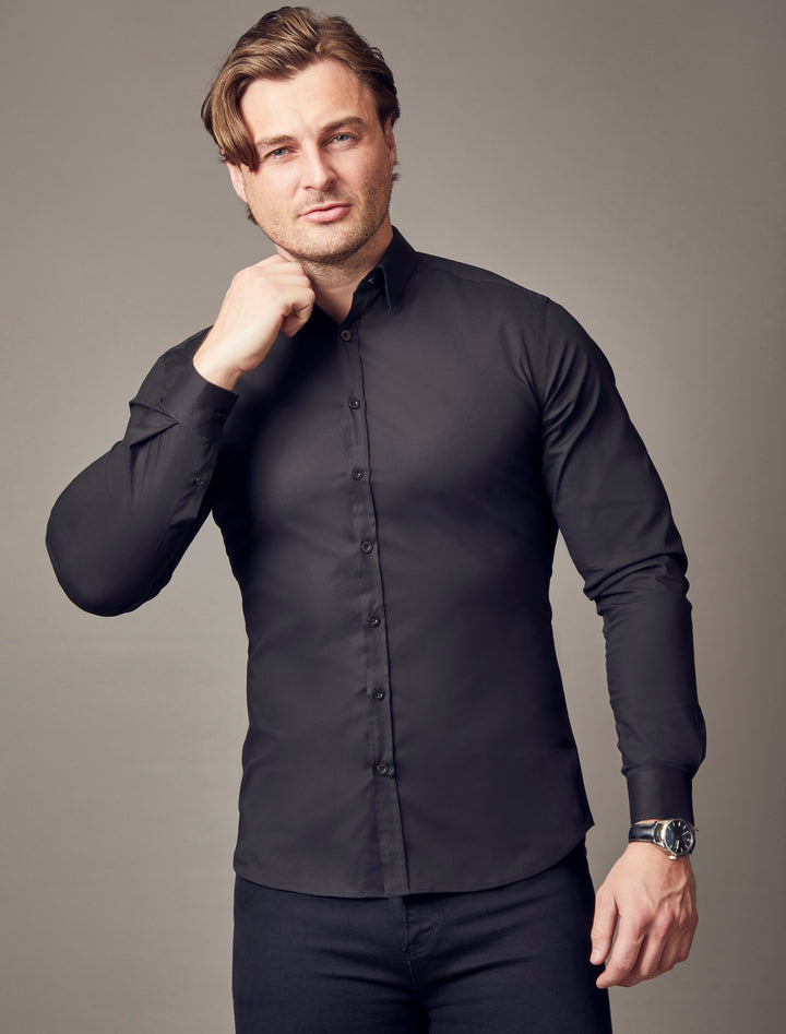 black tapered fit shirt by Tapered Menswear, emphasizing the muscle fit design for a sharp and tailored appearance