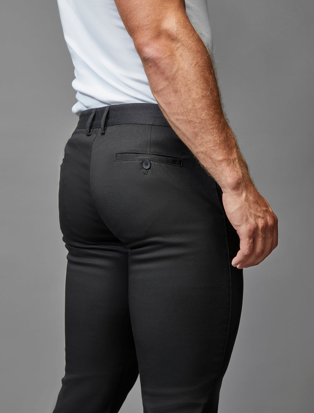 Black athletic fit stretch chinos by Tapered Menswear.