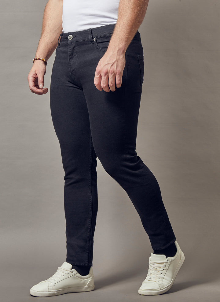 black muscle fit jeans, showcasing the tapered fit and superior quality offered by Tapered Menswear for the discerning man