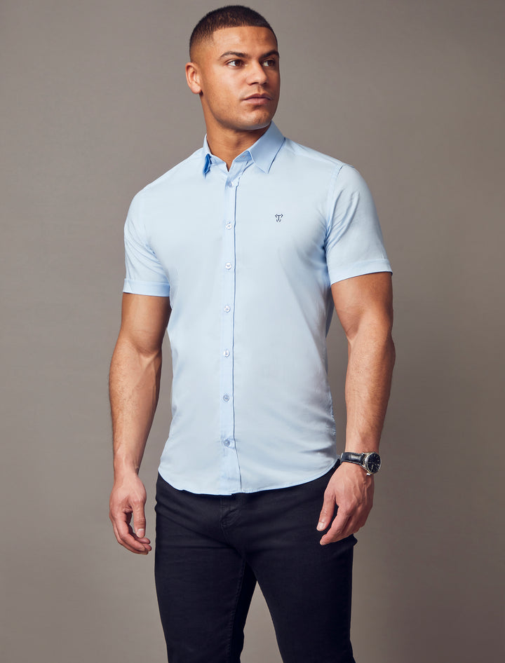 blue muscle fit short sleeve shirt, highlighting the tapered fit and superior quality offered by Tapered Menswear