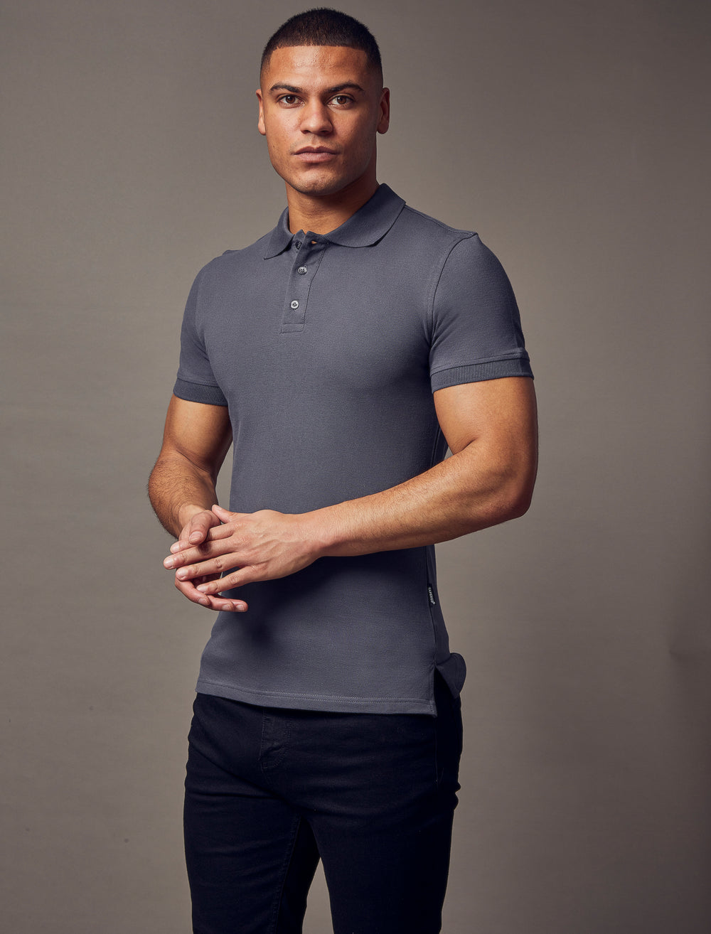 dark grey muscle fit short sleeve polo shirt, highlighting the tapered fit and premium quality offered by Tapered Menswear