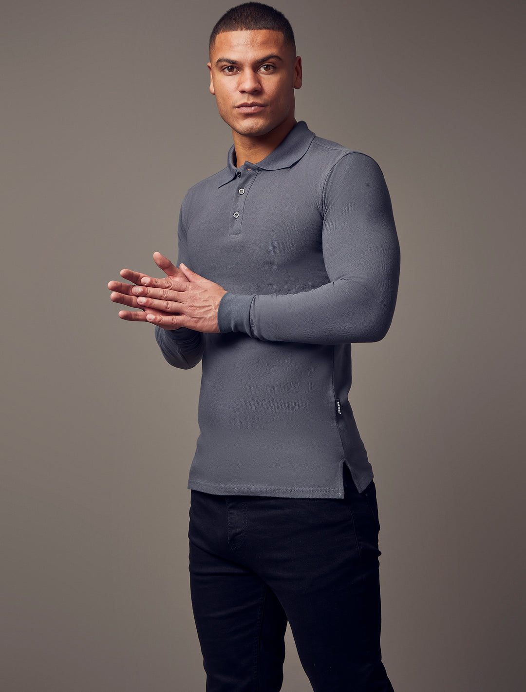  Dark grey, long-sleeve polo shirt with a tapered fit from Tapered Menswear, featuring a muscle-fit design to create a sleek and comfortable silhouette.