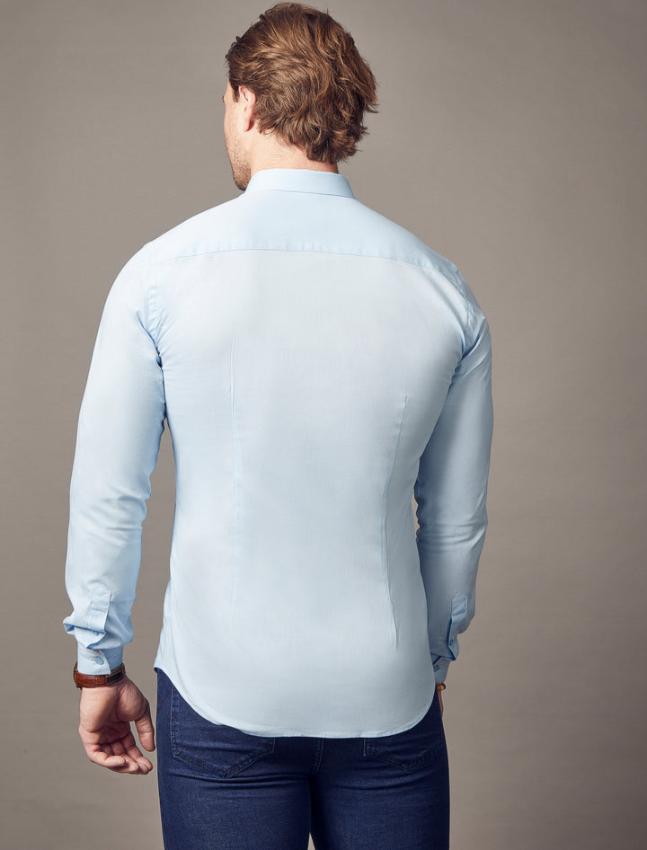 A light blue shirt from Tapered Menswear, crafted with a tapered fit that highlights the muscle-fit design for a flattering and sharply contoured appearance.