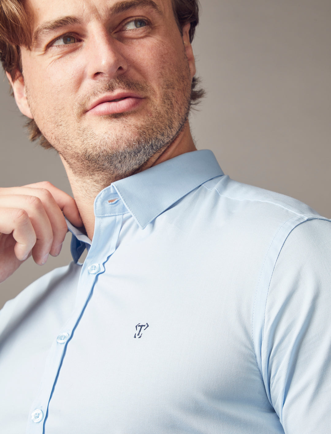 Tapered Menswear's light blue shirt, designed with a tapered fit to enhance the muscle-fit qualities, creating a flattering and well-defined aesthetic.