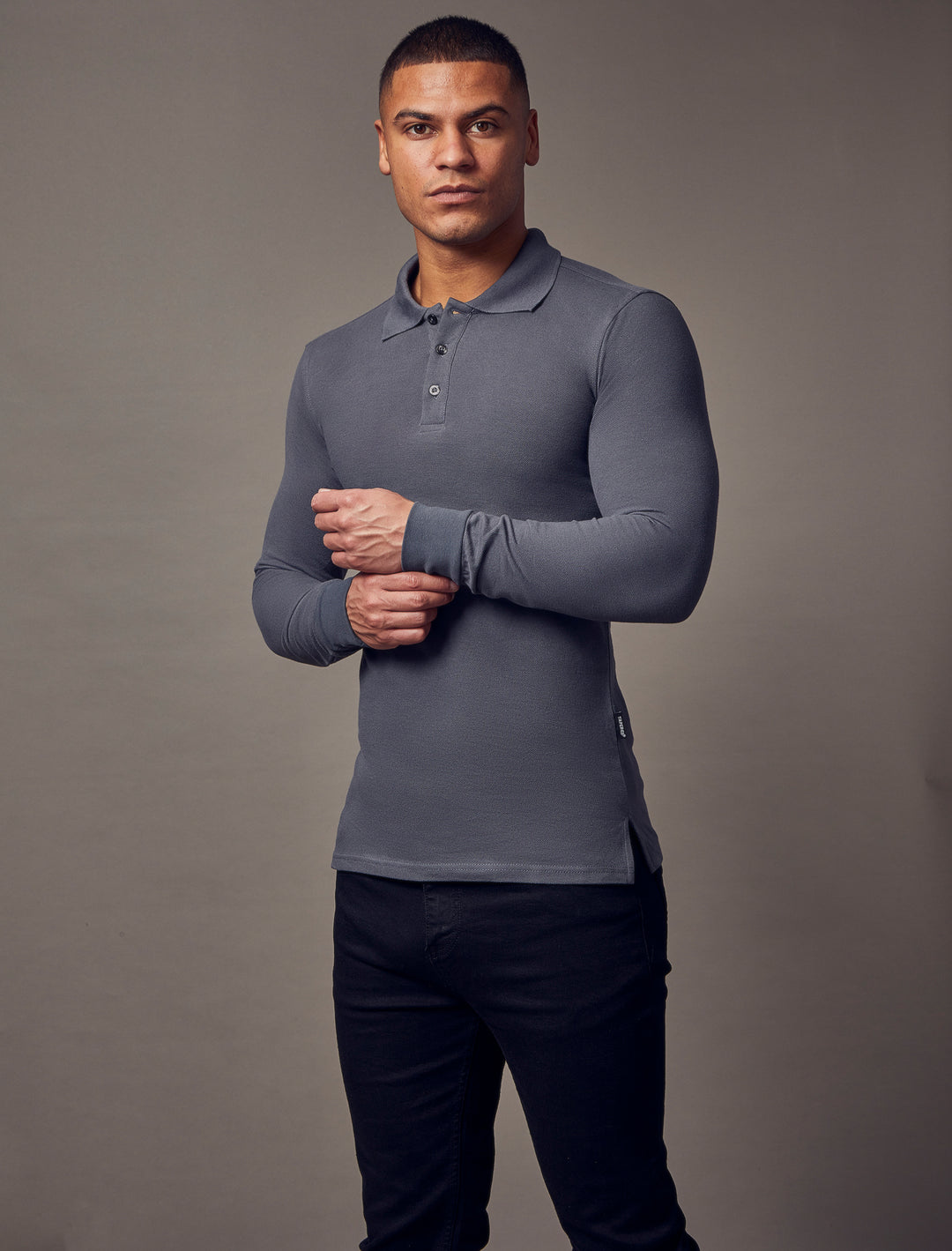  Dark grey, long-sleeve polo shirt with a tapered fit from Tapered Menswear, featuring a muscle-fit design to create a sleek and comfortable silhouette.