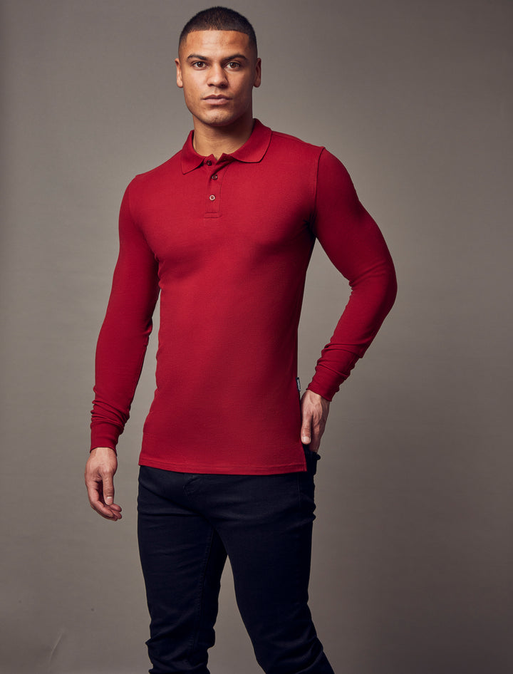 A burgundy tapered fit polo shirt from Tapered Menswear, highlighting the muscle-fit design to create a polished and comfortable silhouette.