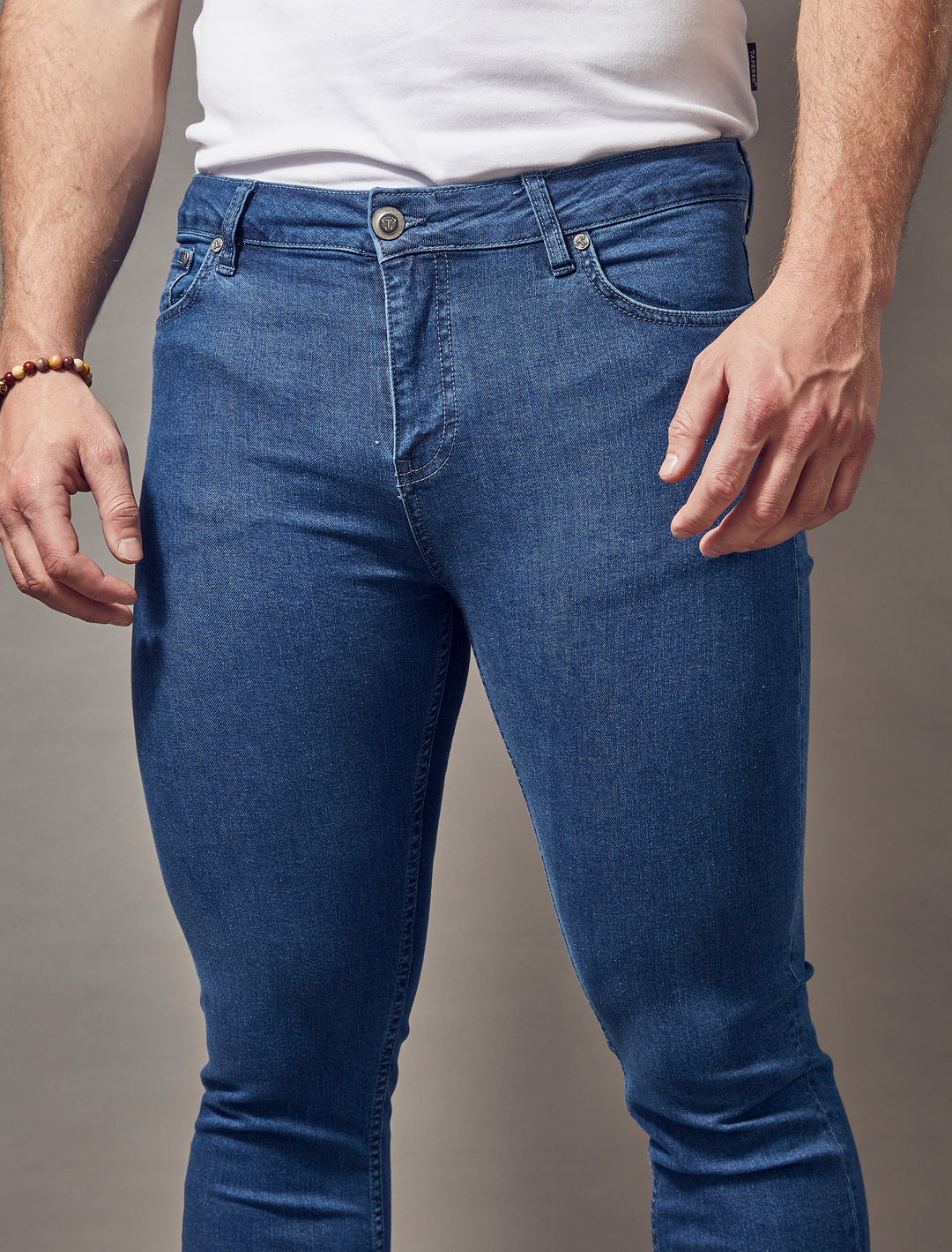 https://taperedmenswear.com/cdn/shop/files/mid-blue-tapered-fit-jeans.jpg?v=1698955859&width=1080