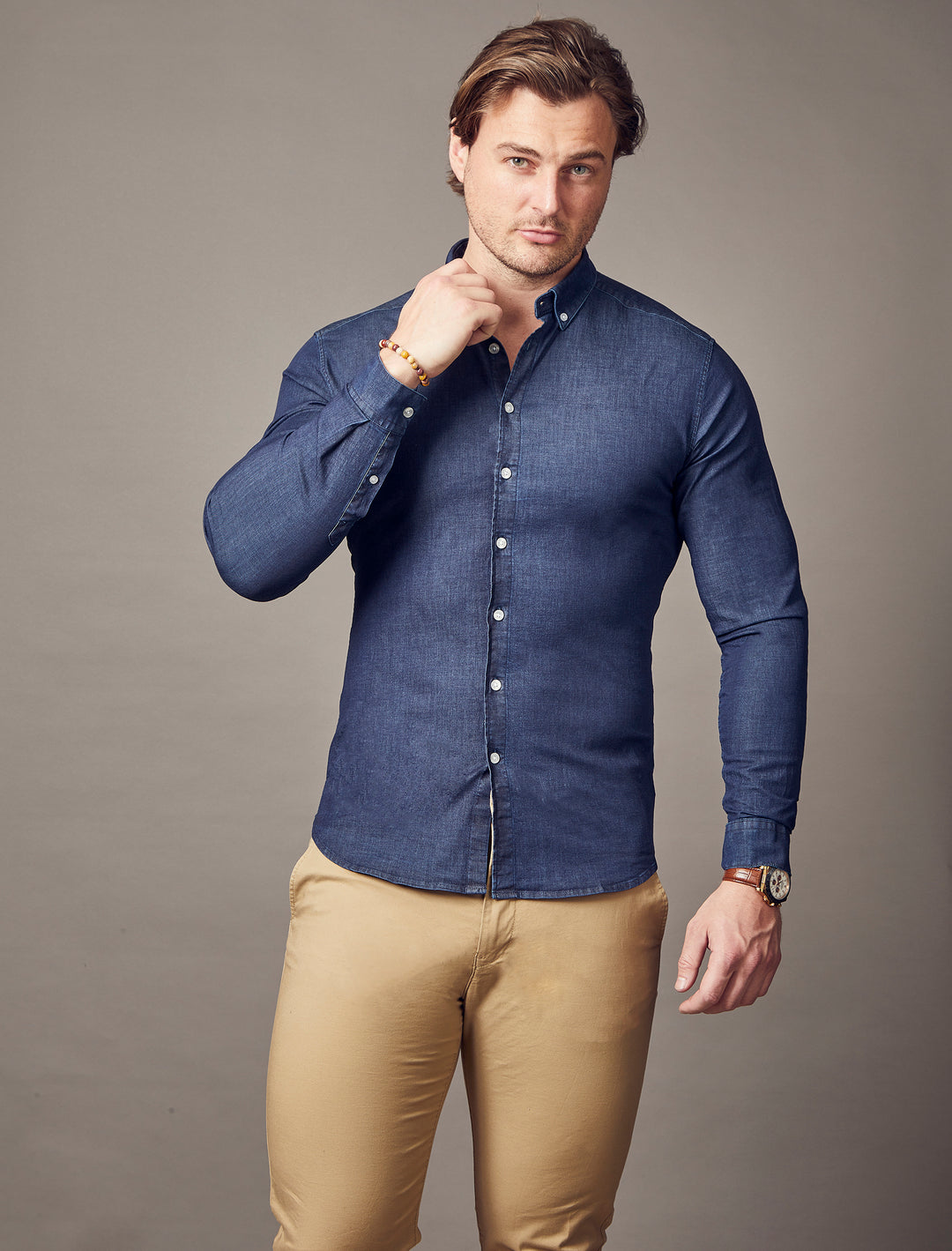 Tapered fit navy blue denim shirt, designed with a muscle fit, perfect for those with a muscular physique.