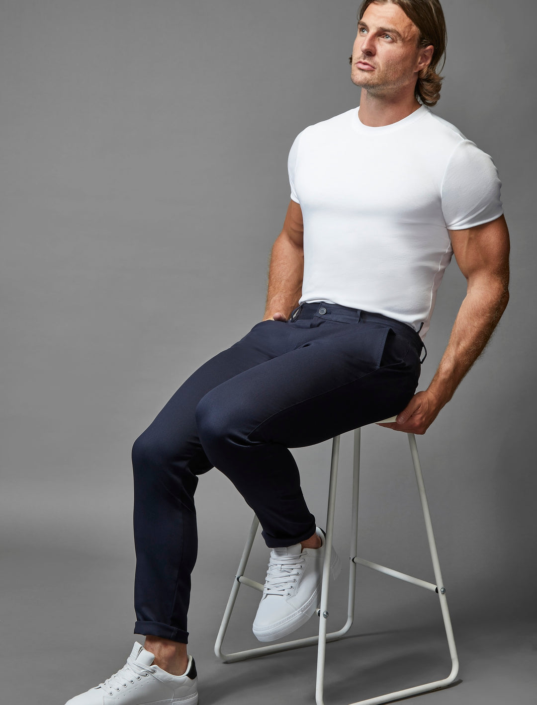 Stretch-enhanced navy chinos by Tapered Menswear, epitomizing the athletic fit trend.