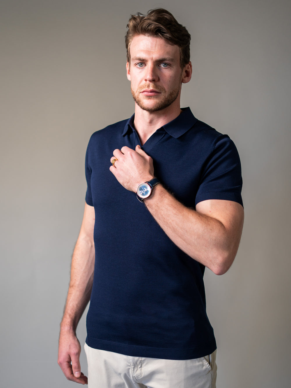 Navy muscle fit knitted polo tailored for broad shoulders and a slim waist
