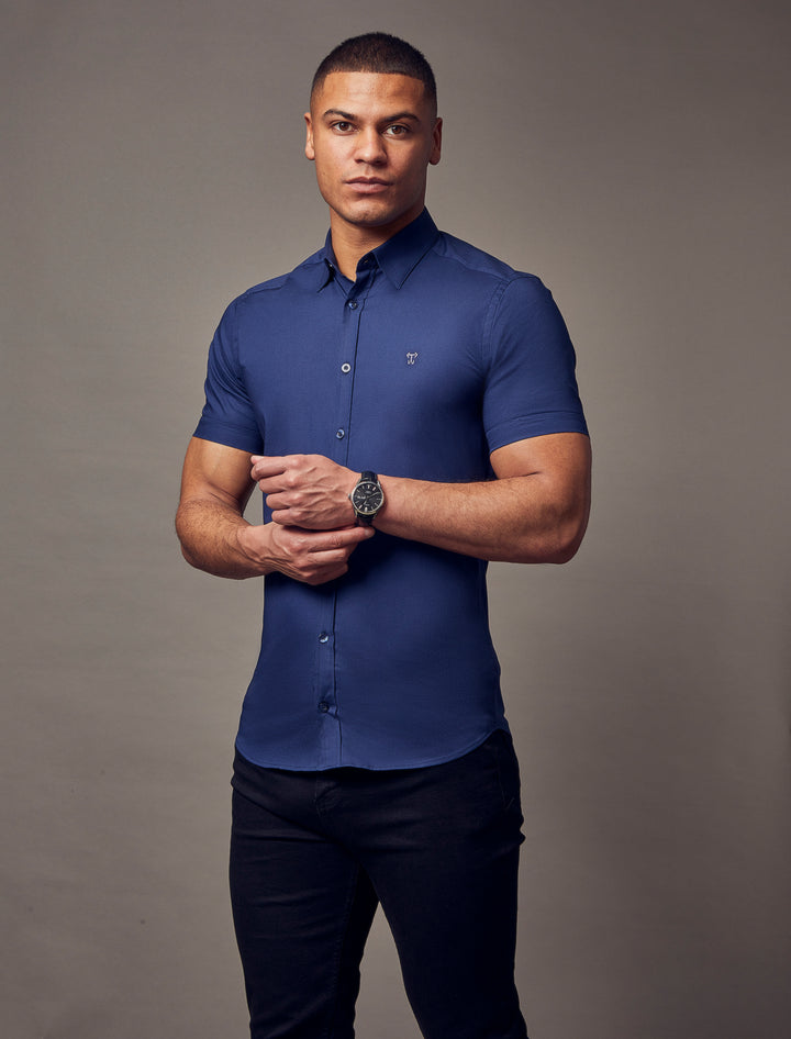 Navy short-sleeve shirt with a tapered fit from Tapered Menswear, highlighting the muscle-fit design for a flattering and sculpted appearance.