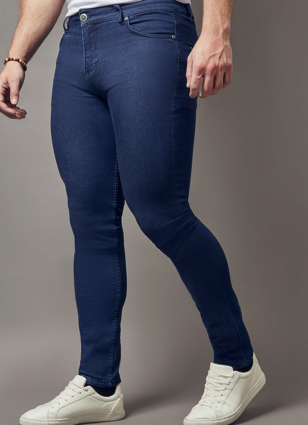 navy tapered fit jeans by Tapered Menswear, showcasing the muscle fit design for a comfortable and well-sculpted silhouette