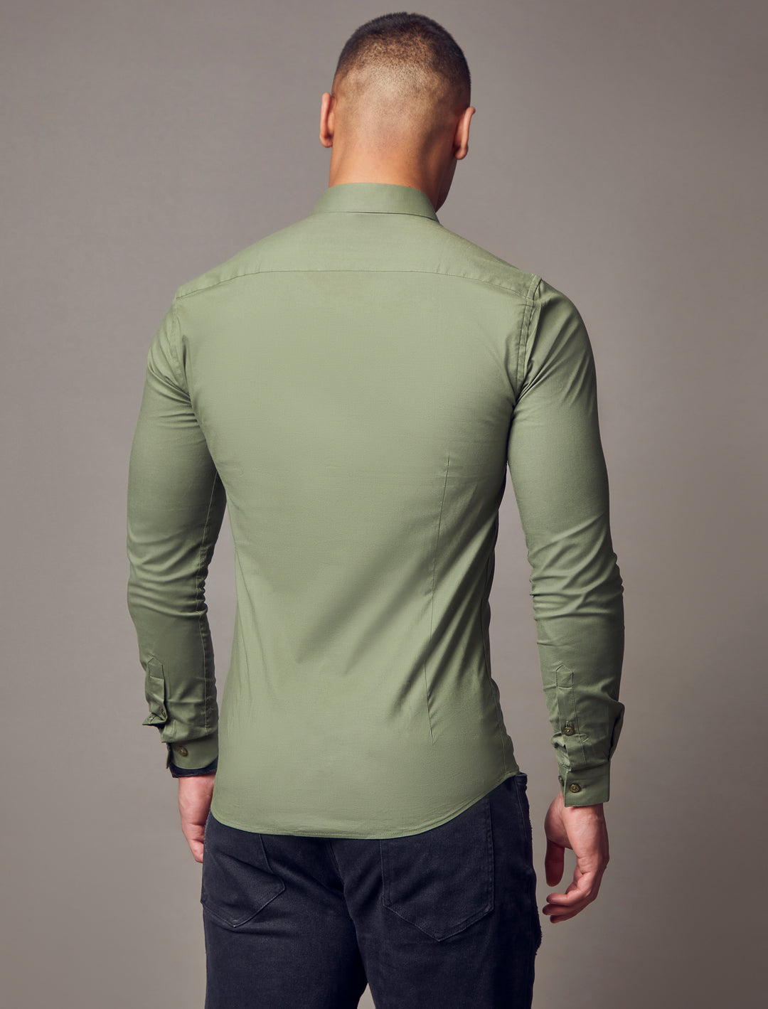 olive tapered fit shirt, emphasizing the muscle fit features for a flattering and well-defined look by Tapered Menswear