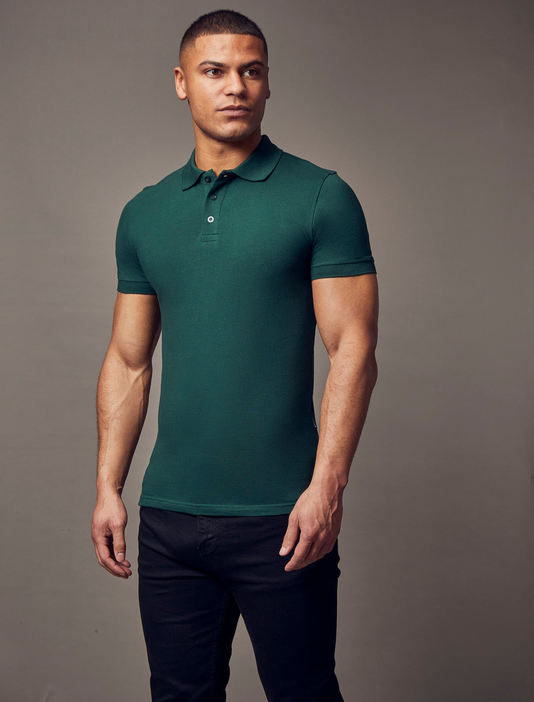 A green polo shirt with short sleeves from Tapered Menswear, designed in a tapered fit to accentuate the muscle-fit features for a sleek and defined look.