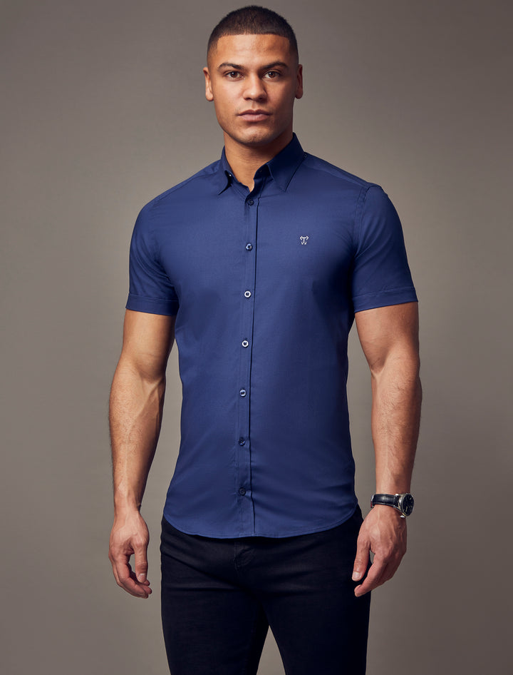 Navy muscle fit short sleeve shirt, highlighting the tapered fit and premium quality offered by Tapered Menswear