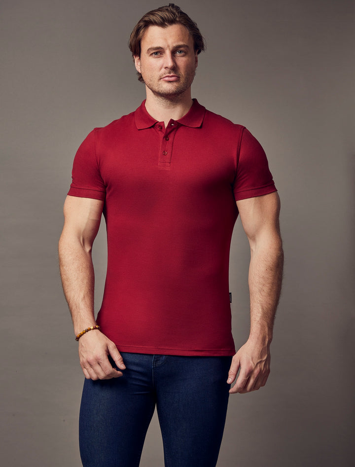 A high-quality, muscle-fit, short-sleeve polo shirt in burgundy, crafted by Tapered Menswear, showcasing its sleek, tapered design.