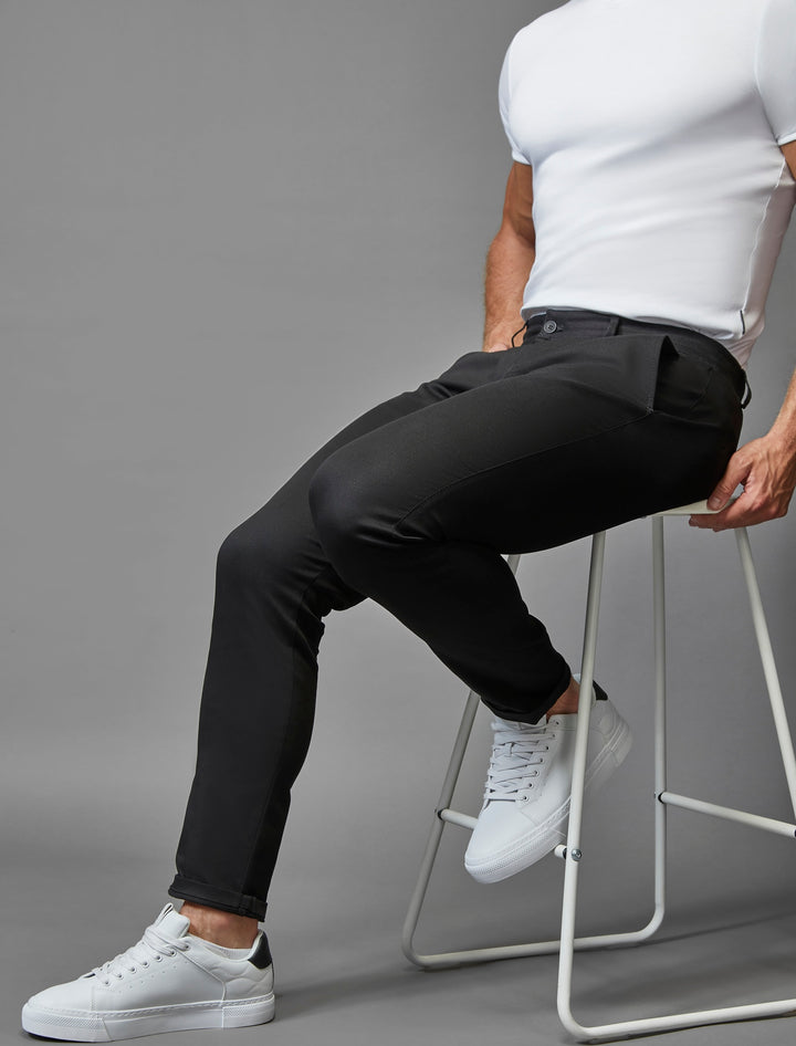 Tapered Menswear's black chinos, seamlessly blending an athletic fit with the flexibility of stretch.