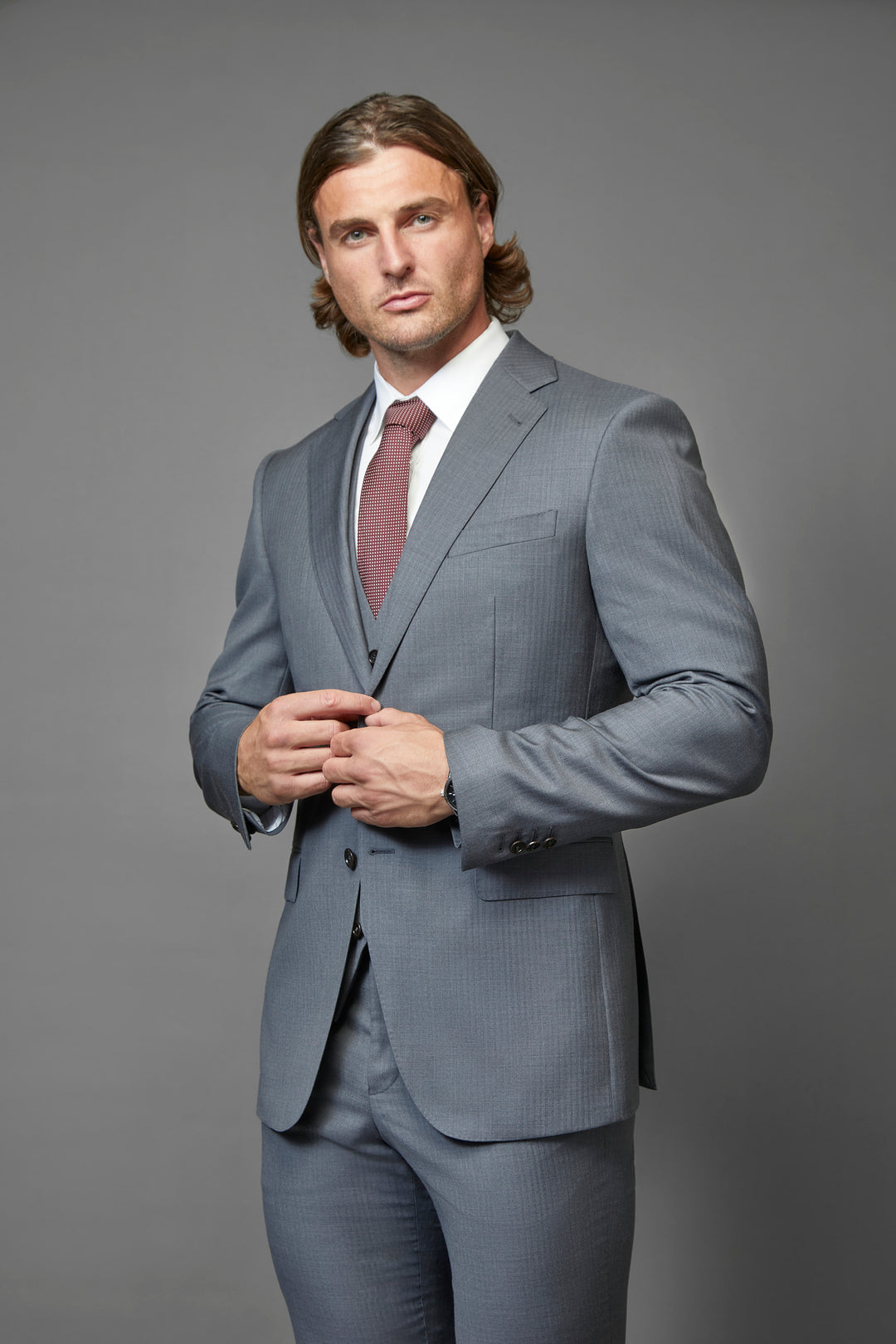  Tapered Menswear's Bespoke Suit, tailored for muscular builds with a perfect fit, crafted from 100% Australian wool in various colors and styles, ideal for athletic physiques