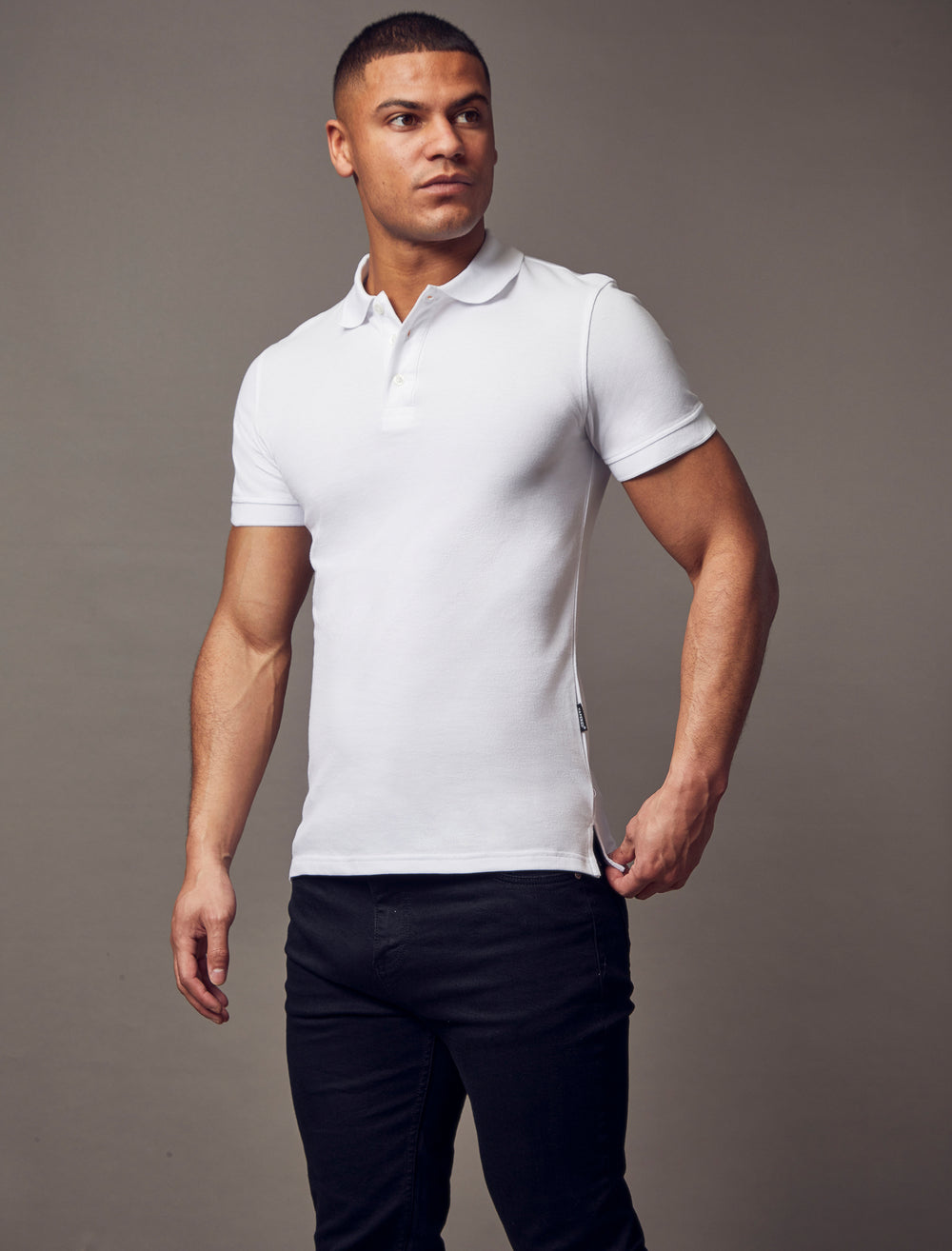white muscle fit short sleeve polo shirt, highlighting the tapered fit and premium quality offered by Tapered Menswear 
