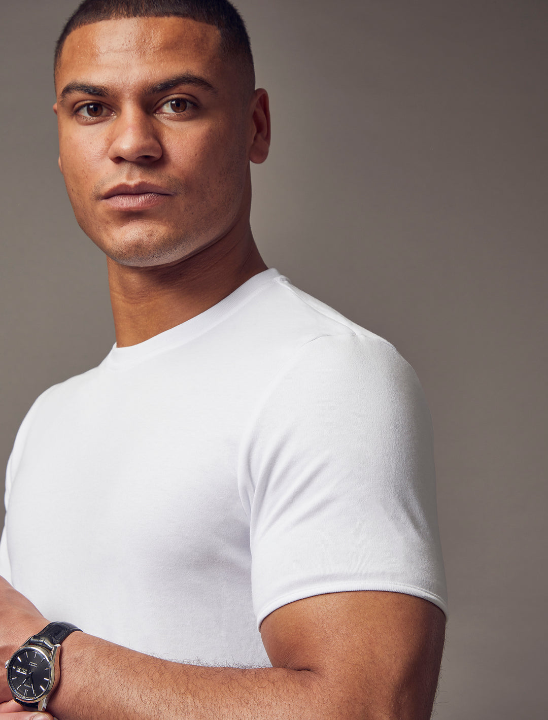 A white, tapered-fit T-shirt by Tapered Menswear, designed to showcase the muscle fit for a silhouette that is both stylish and comfortable.