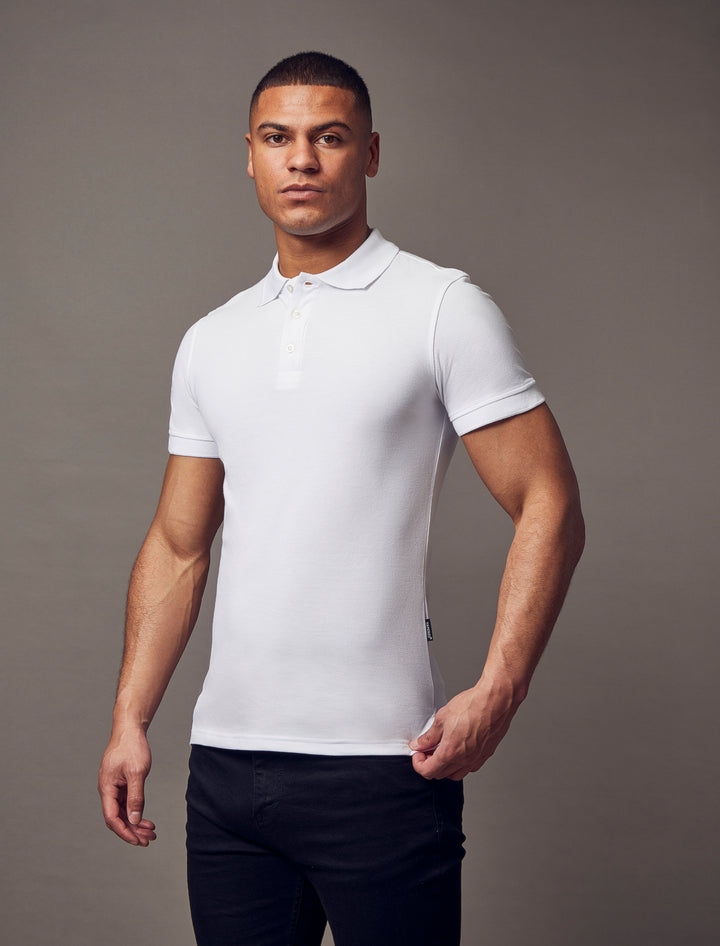 A white, short-sleeve polo shirt with a tapered fit from Tapered Menswear, featuring a muscle fit design for a sleek and comfortable silhouette.