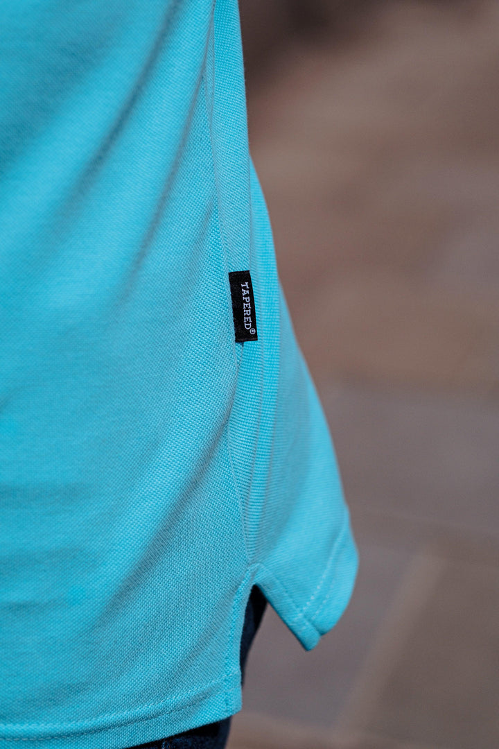 Turquoise Muscle Fit Polo Shirt. A Proportionally Fitted and Muscle Fit Polo in Turquoise. Ideal for bodybuilders.