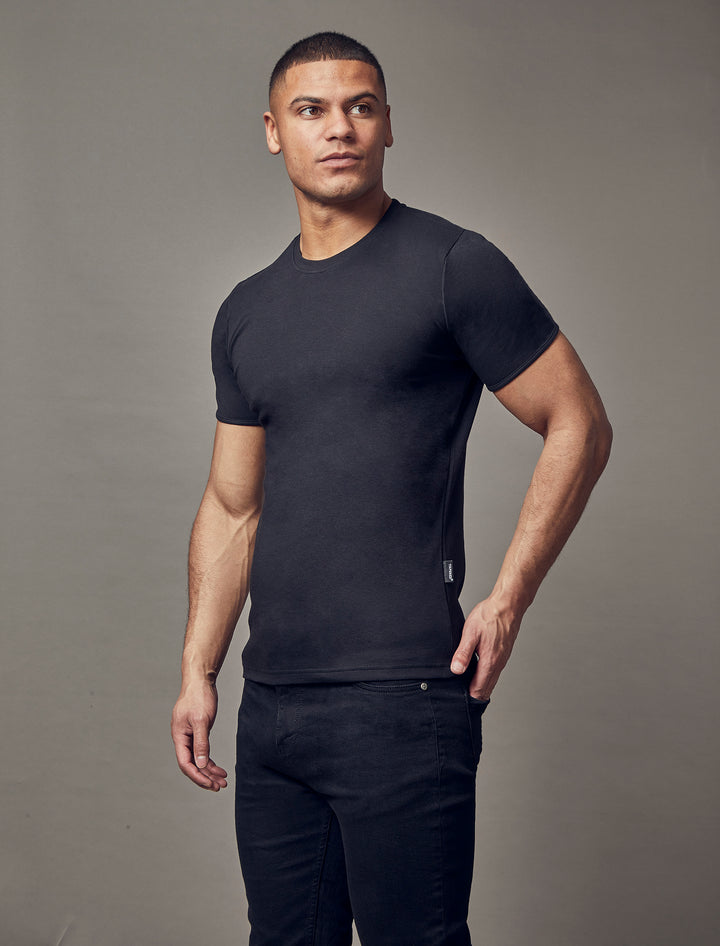 black muscle fit t-shirt, highlighting the tapered fit and superior quality offered by Tapered Menswear for the contemporary man