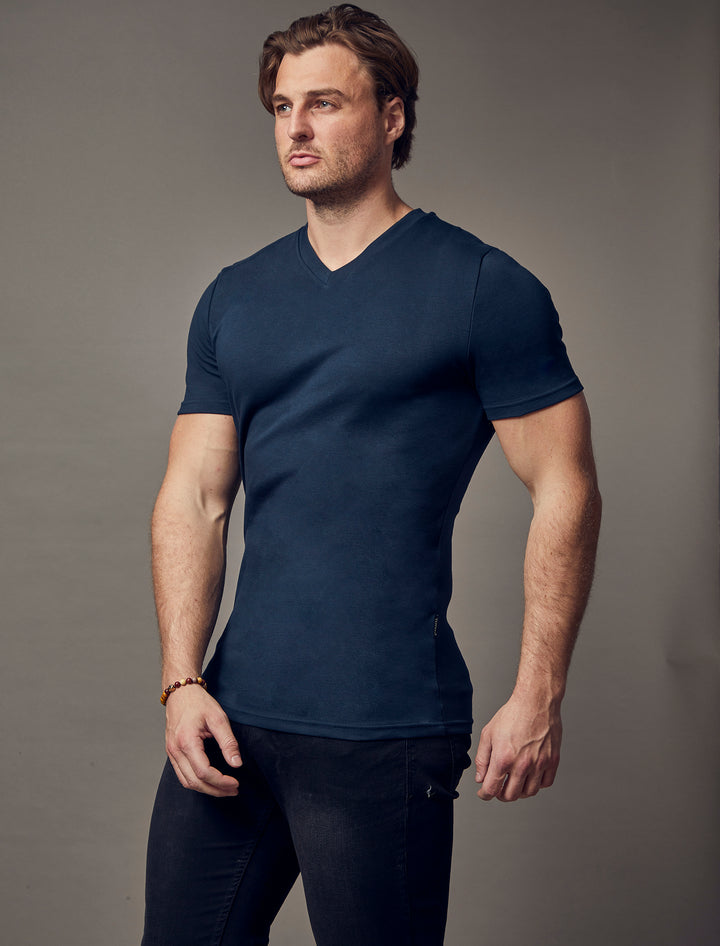 navy muscle fit V-neck t-shirt, highlighting the tapered fit and premium quality offered by Tapered Menswear